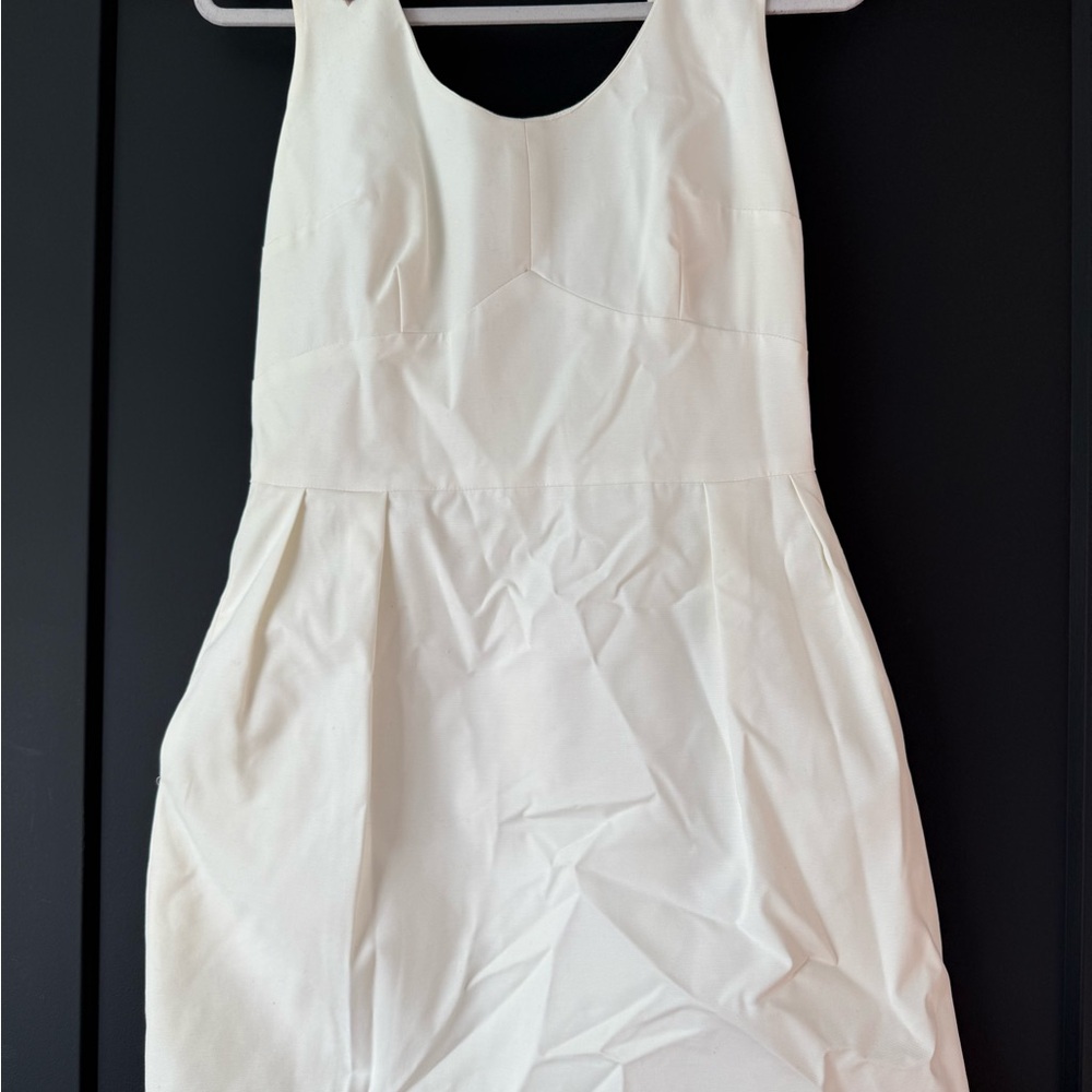 White sleeveless dress with beaded shoulders